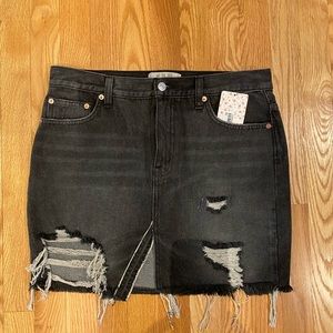 FREE PEOPLE Black denim mini skirt.
